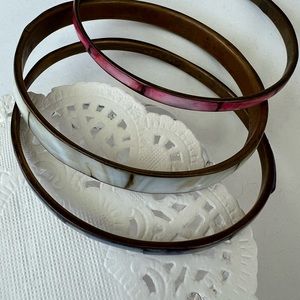 Bracelets, Trio of shell and brass bangles